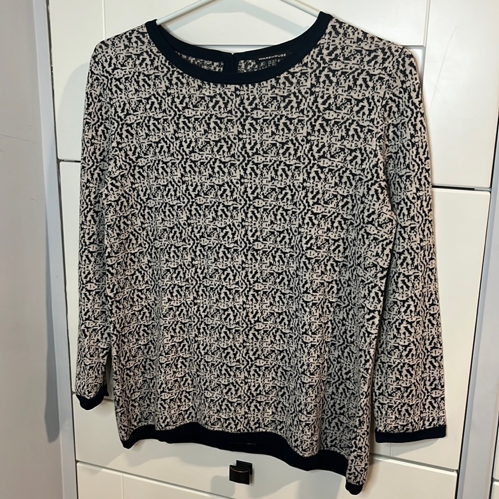 Warehouse. Size 6. Cream and black sweater. Button up back.